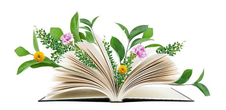 open book wreathed in flowers